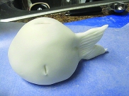 With the fish, you need to pull out some fondant for the tail fine on one side. Cut little indents into top and sides for easy placement of dried fins.